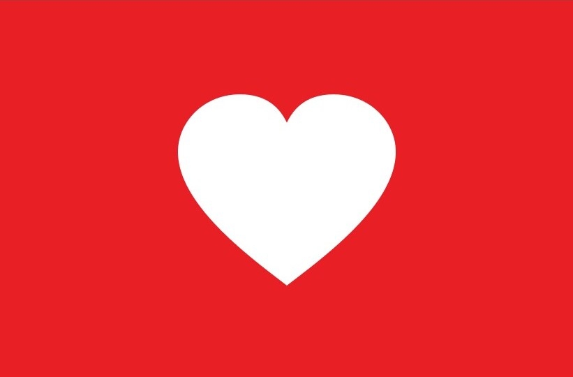 Purina Cares for communities logo with white heart on a red background