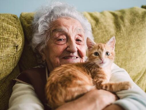 elderly woman with a cat
